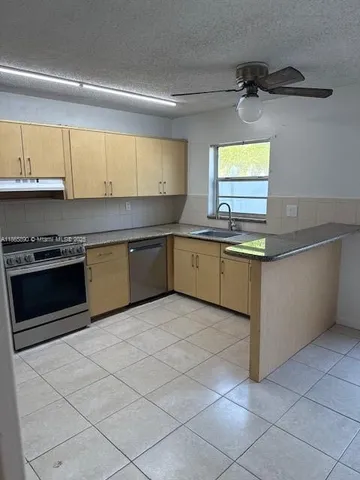 a view of a kitchen with a sink