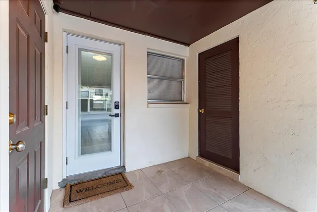 a view of a kitchen with wooden floor and electronic appliances