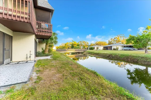a view of a balcony with wooden floor