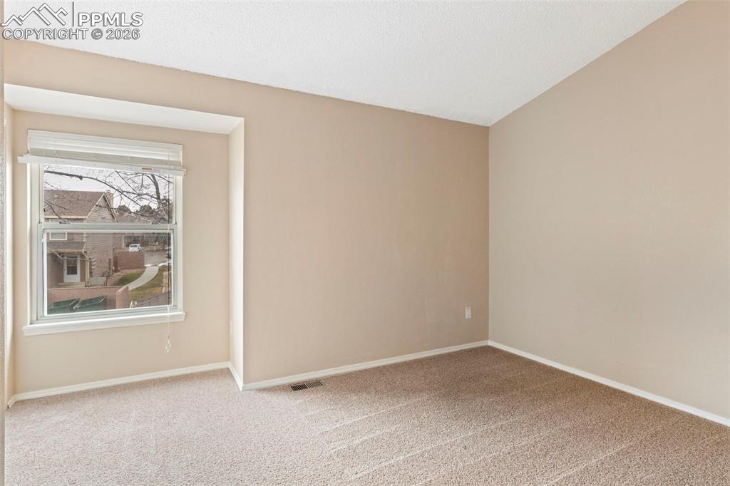 4315 Hunting Meadows Circle, Unit 1 Colorado Springs, CO 80916 - Photo 13 of 26 an empty room with a window