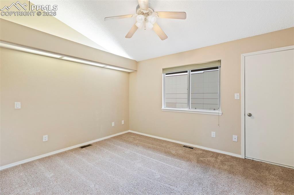 4315 Hunting Meadows Circle, Unit 1 Colorado Springs, CO 80916 - Photo 19 of 26 a view of an empty room with a window