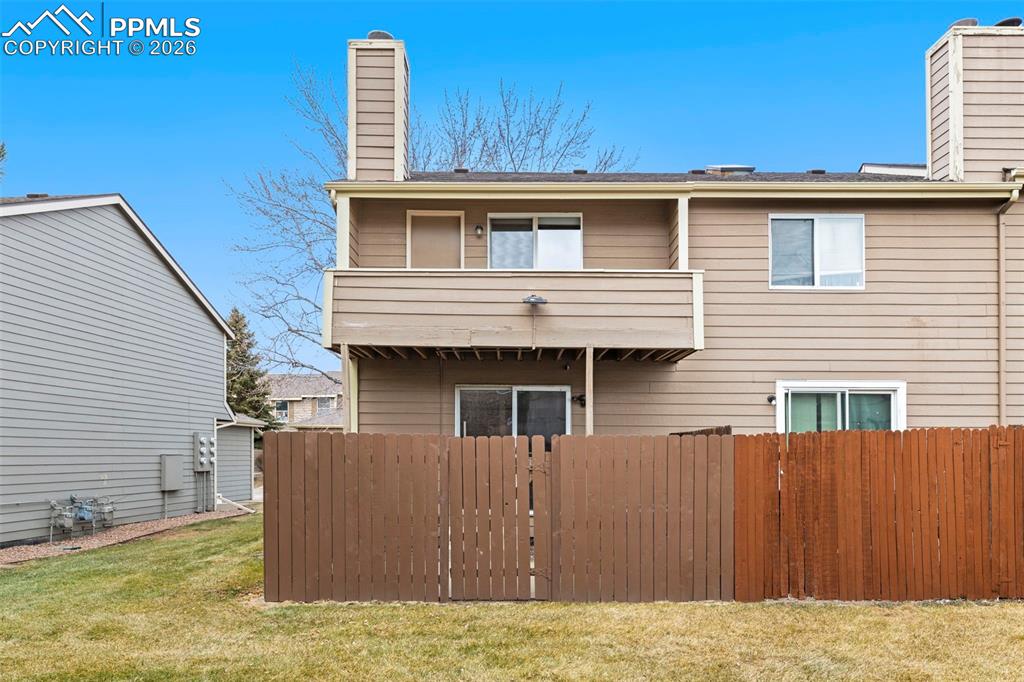 4315 Hunting Meadows Circle, Unit 1 Colorado Springs, CO 80916 - Photo 26 of 26 a view of a house with a backyard