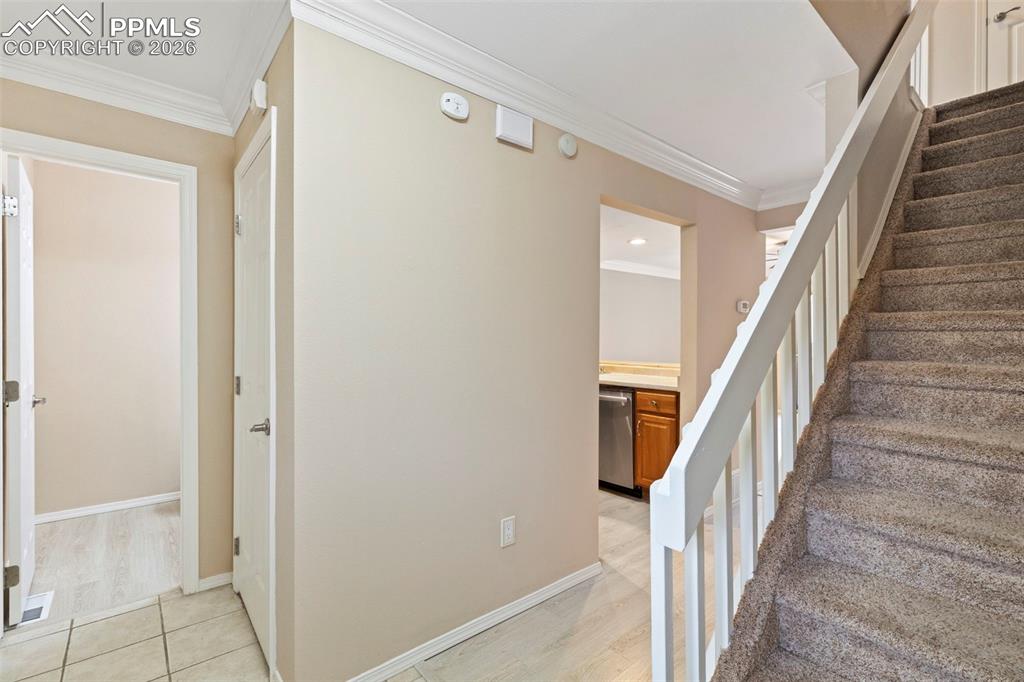 4315 Hunting Meadows Circle, Unit 1 Colorado Springs, CO 80916 - Photo 10 of 26 a view of staircase with wooden floor and staircase
