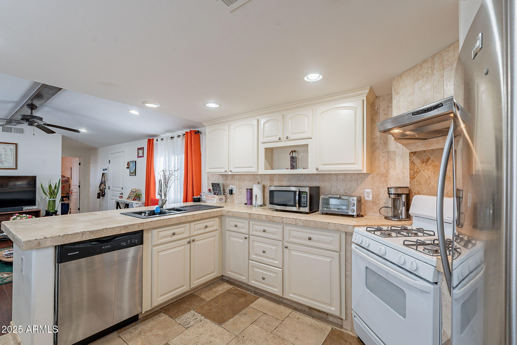 15606 South Gilbert Road, Unit 63 Chandler, AZ 85225 - Photo 8 of 21 a kitchen with a sink stove and cabinets