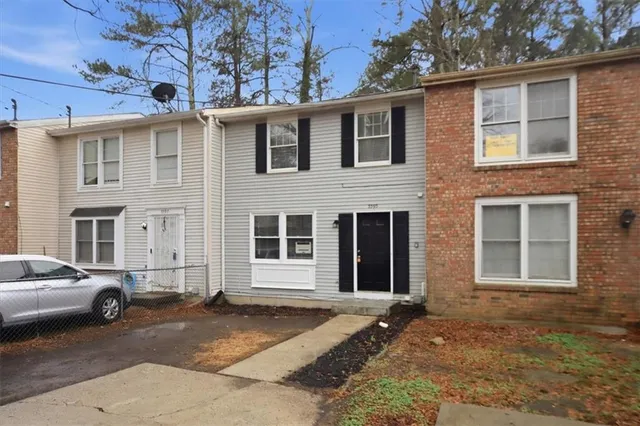 a view of a car parked in front of a building