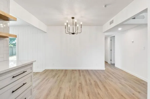a view of kitchen with wooden floor