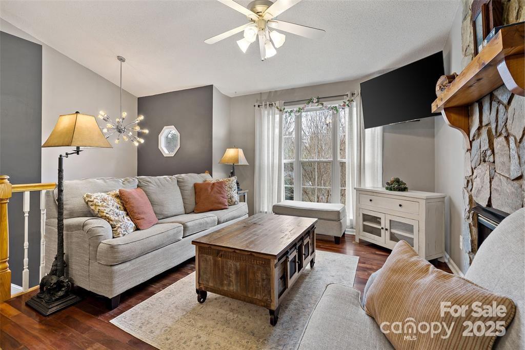 2691 Laurel Point Drive Nebo, NC 28761 - Photo 11 of 44 a living room with furniture and a flat screen tv