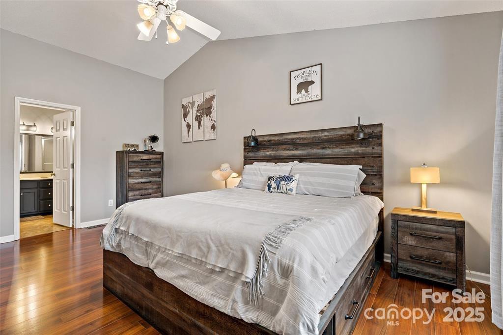 2691 Laurel Point Drive Nebo, NC 28761 - Photo 22 of 44 a bedroom with a bed and wooden floor