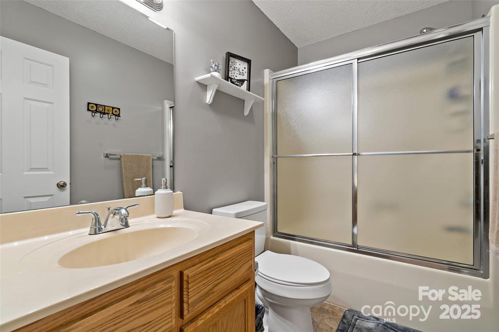 2691 Laurel Point Drive Nebo, NC 28761 - Photo 28 of 44 a bathroom with a sink toilet and shower