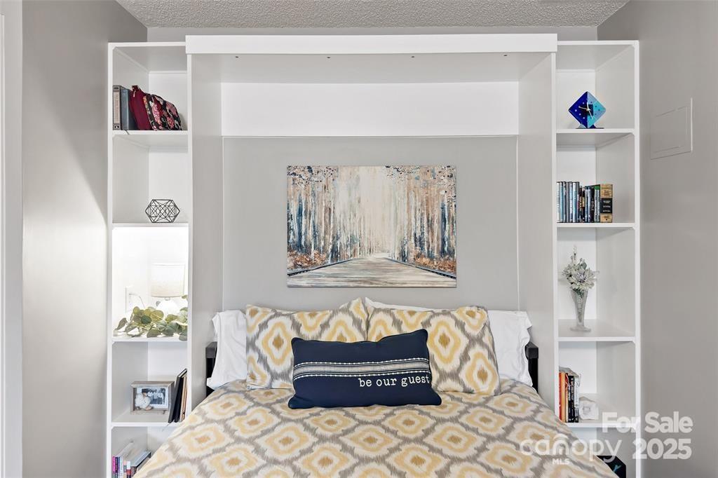 2691 Laurel Point Drive Nebo, NC 28761 - Photo 32 of 44 a bedroom with a bed and a window