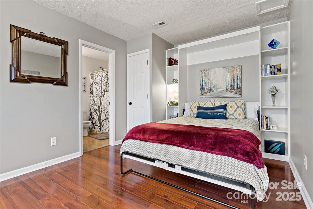 2691 Laurel Point Drive Nebo, NC 28761 - Photo 33 of 44 a bed sitting in a bedroom next to a window