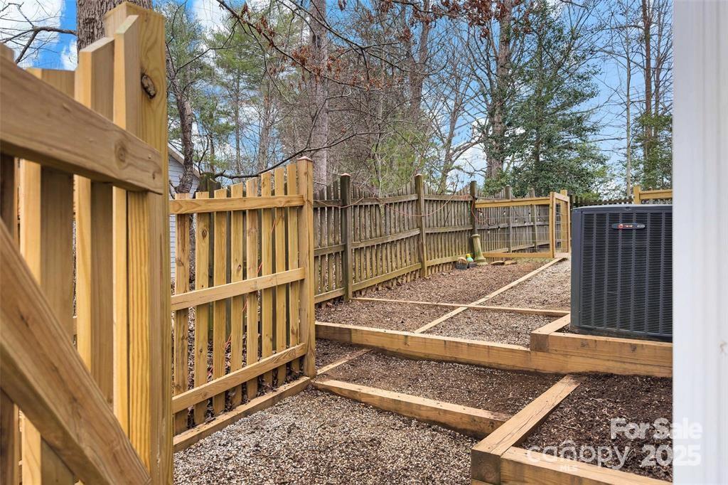 2691 Laurel Point Drive Nebo, NC 28761 - Photo 36 of 44 a view of a backyard with a deck and a patio