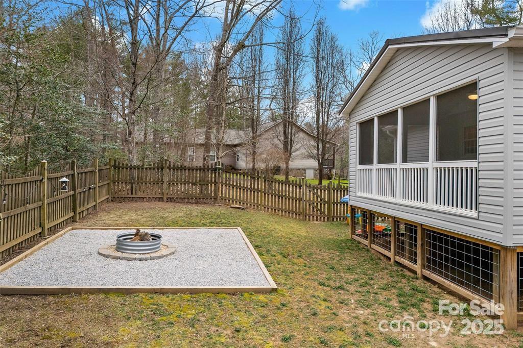 2691 Laurel Point Drive Nebo, NC 28761 - Photo 37 of 44 a view of a house with backyard and deck