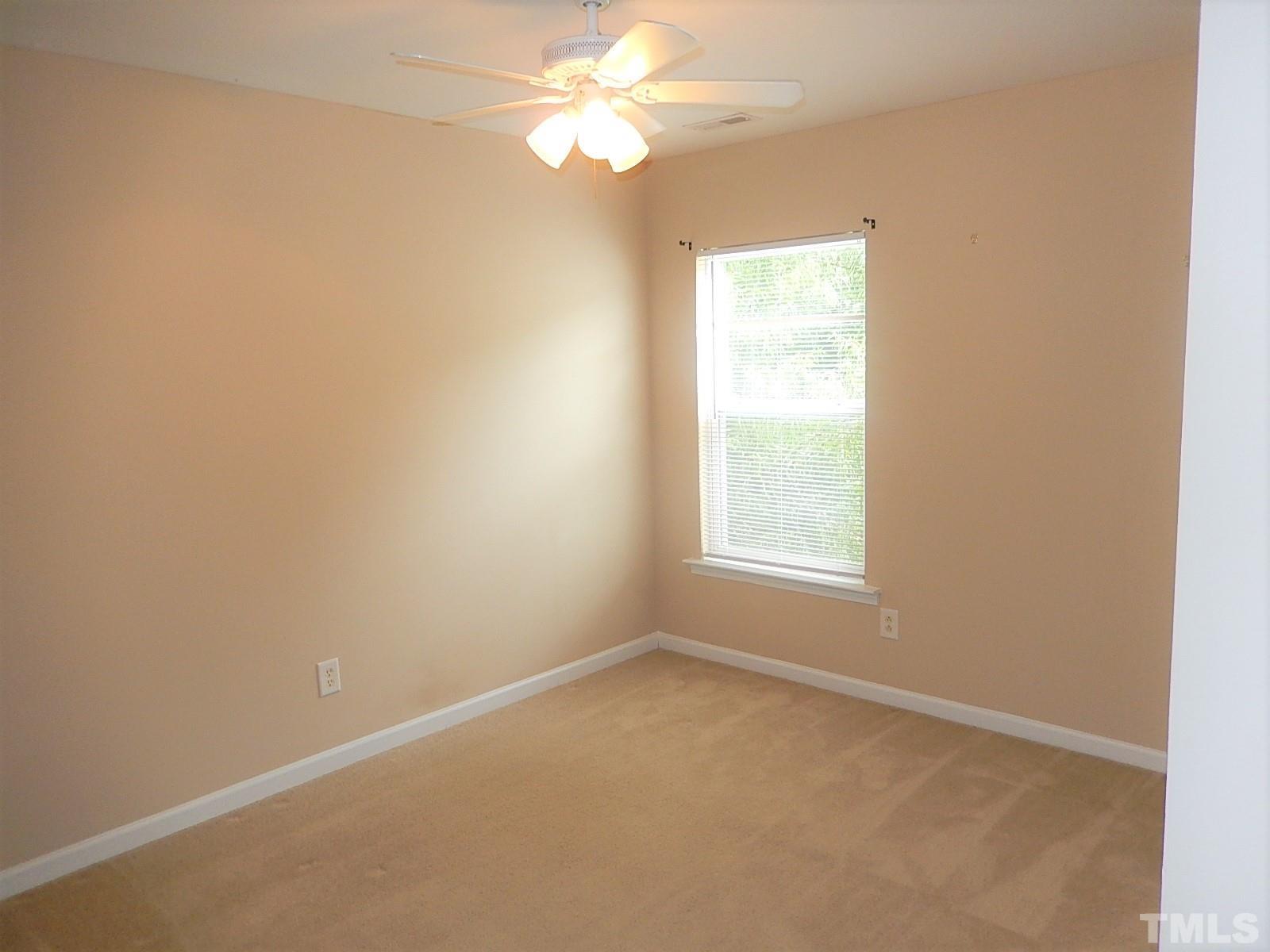 101 Olvera Way Holly Springs, NC 27540 - Photo 19 of 25 an empty room with a window