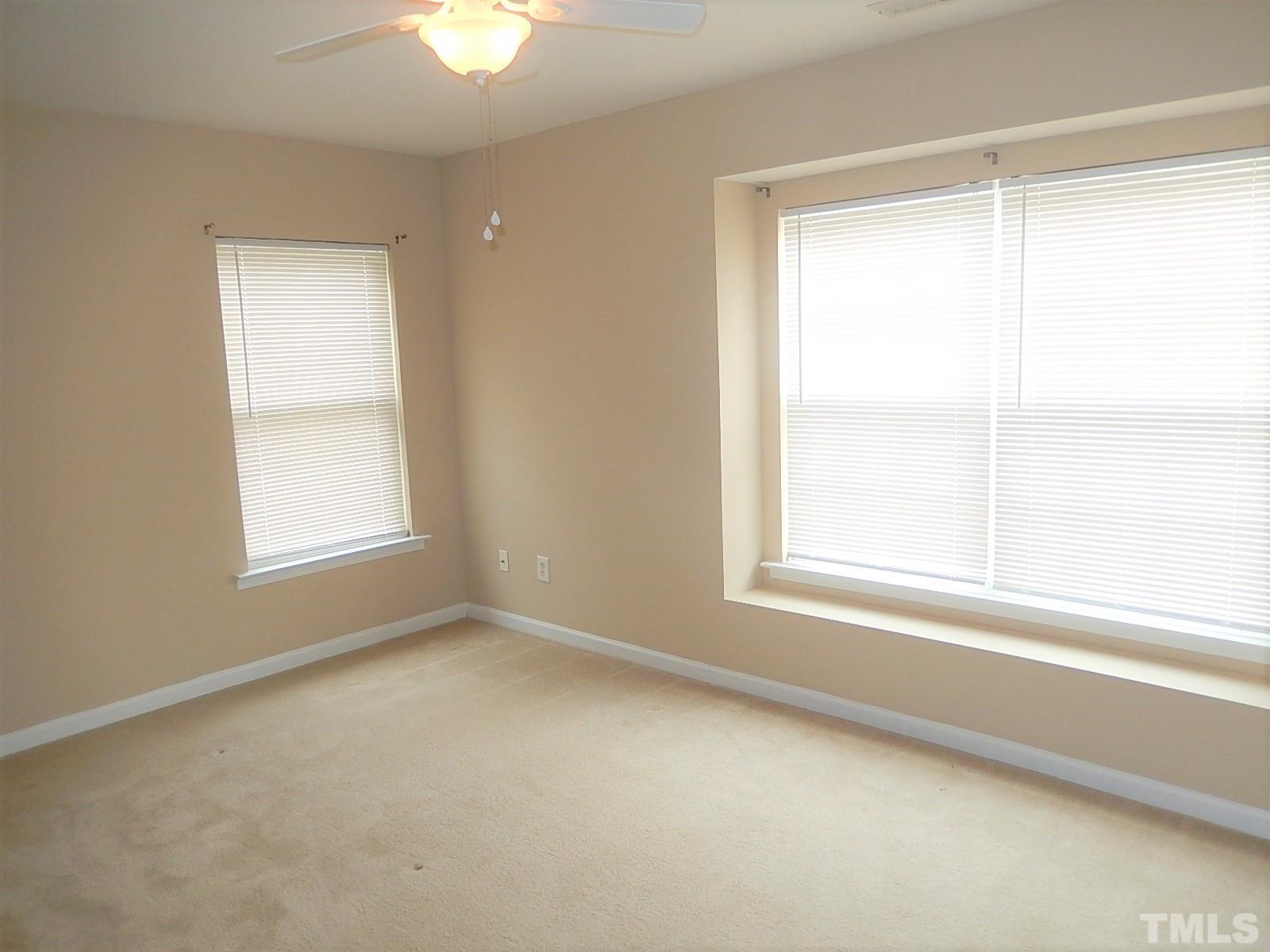 101 Olvera Way Holly Springs, NC 27540 - Photo 20 of 25 an empty room with a window
