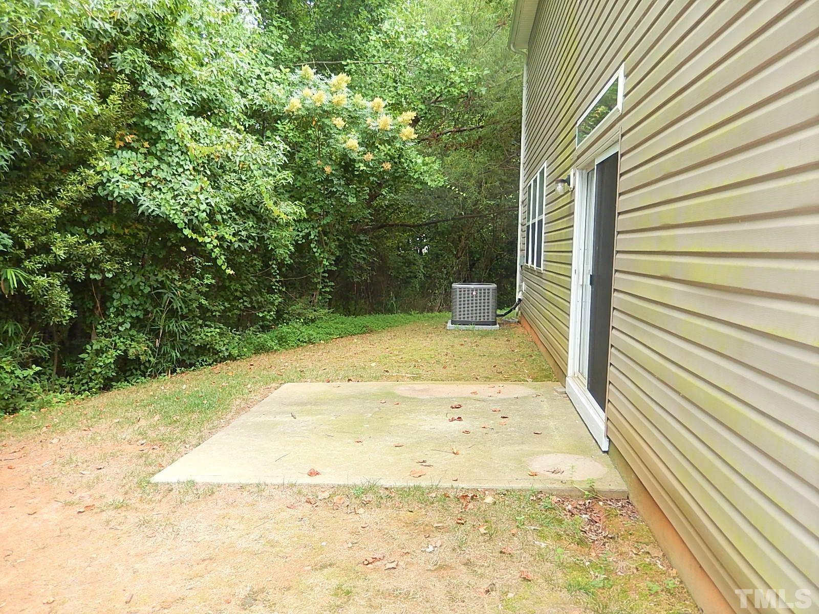 101 Olvera Way Holly Springs, NC 27540 - Photo 24 of 25 a view of a backyard