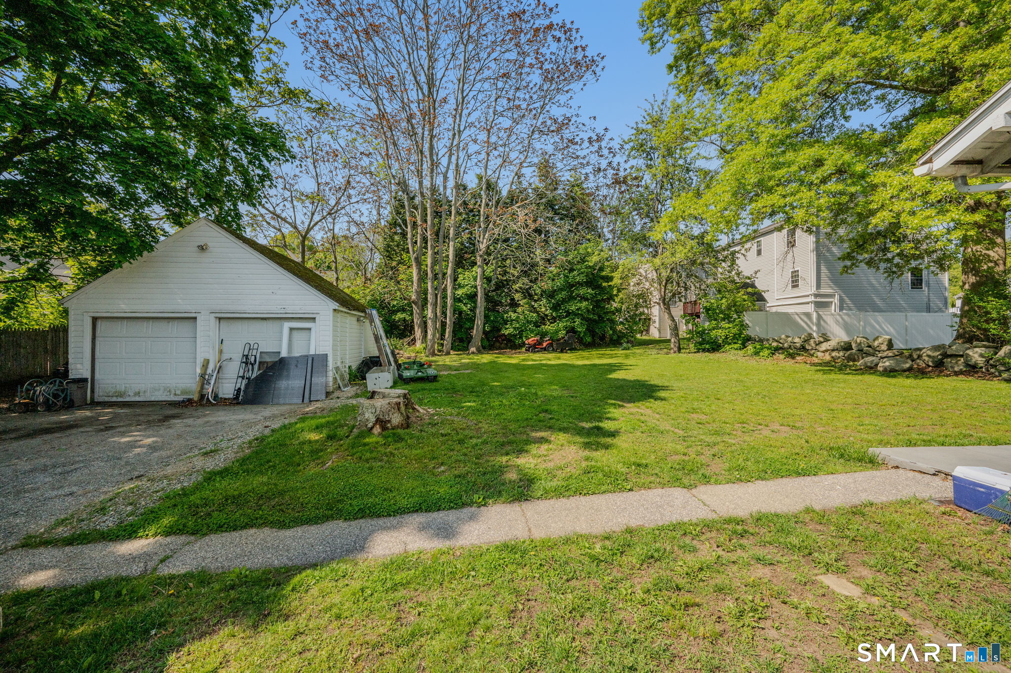231 Poquonnock Road Groton, CT 06340 - Photo 29 of 30 a view of a house with a yard and sitting area