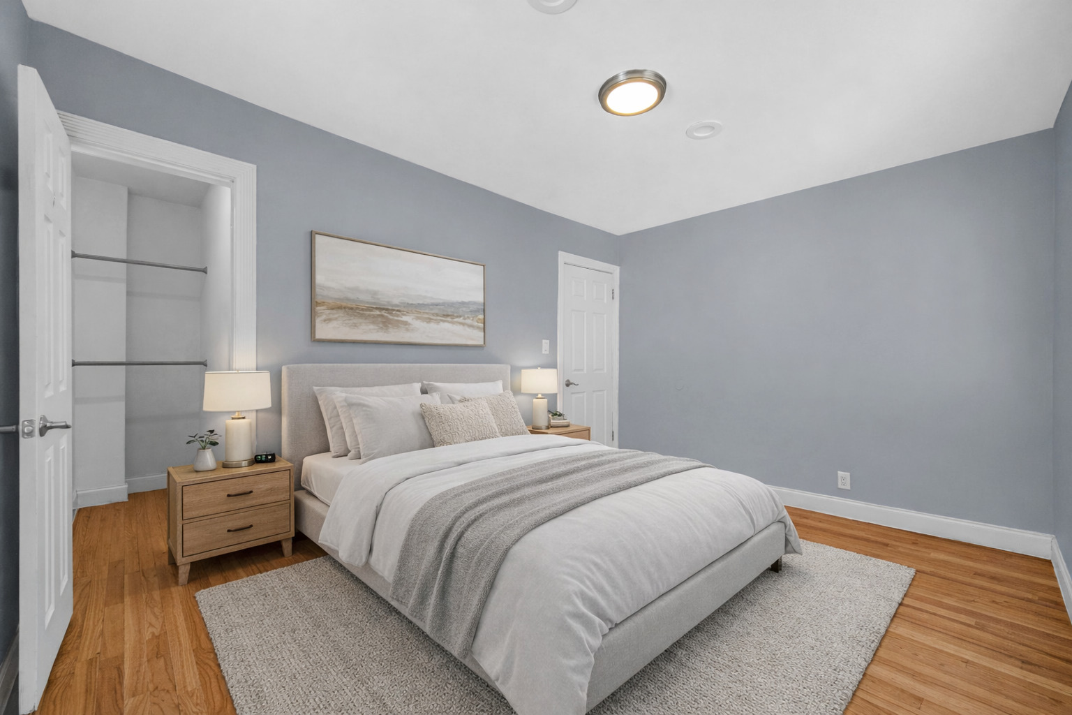 1336 East 73rd Street Chicago, IL 60619 - Photo 9 of 16 a bedroom with a bed and a night stand