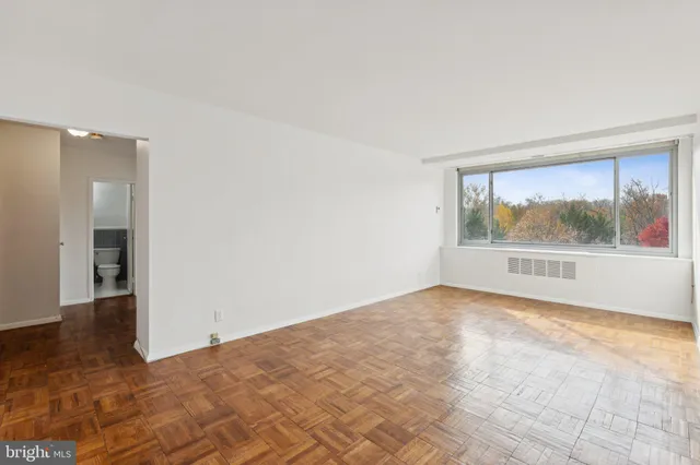 a view of an empty room with a window