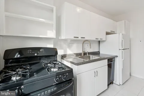 a kitchen with a stove and a sink