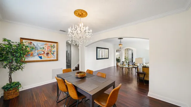 a kitchen with stainless steel appliances kitchen island granite countertop a refrigerator and microwave