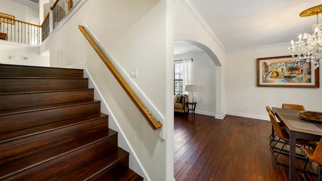 a view of entryway and hall with wooden floor