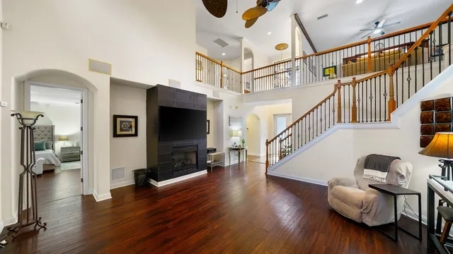 a view of entryway and hall with wooden floor