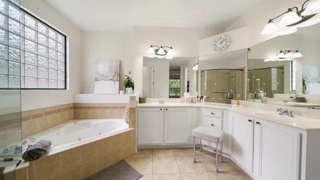 a white toilet sitting next to a shower curtain