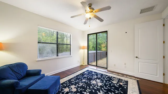 a view of a backyard patio with swimming pool table and chairs