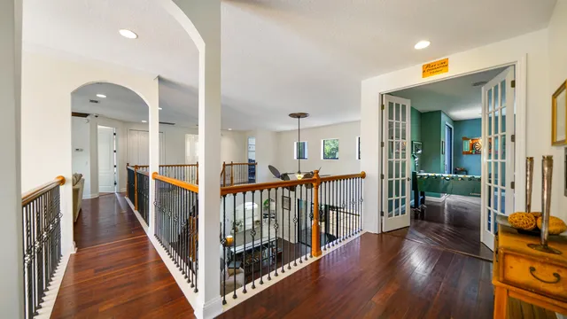 an aerial view of a house with garden space and a patio