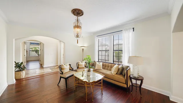 a view of a livingroom with furniture and a potted plant