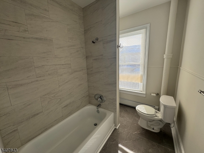 27 Filmore Street Phillipsburg, NJ 08865 - Photo 11 of 15 a bathroom with a toilet and bathtub