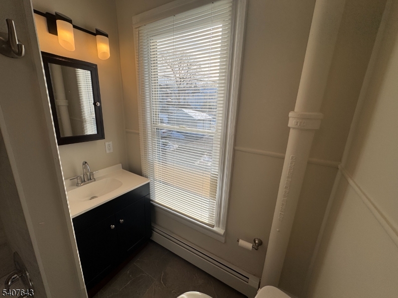 27 Filmore Street Phillipsburg, NJ 08865 - Photo 15 of 15 a bathroom with a sink a mirror and a shower