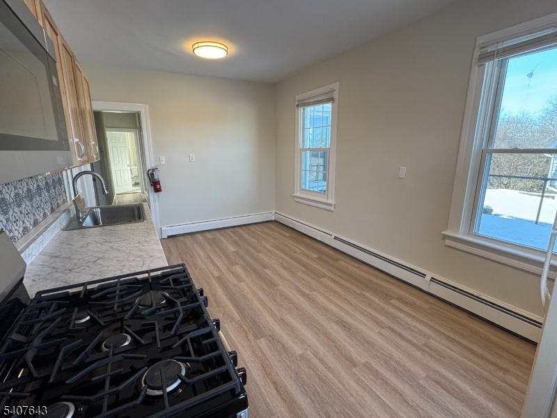 27 Filmore Street Phillipsburg, NJ 08865 - Photo 8 of 15 a bed sitting in a bedroom next to a window