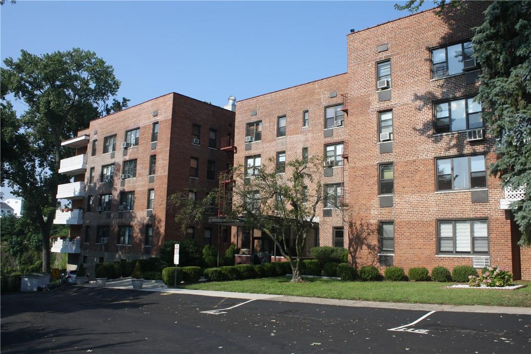 a view of a building with a yard
