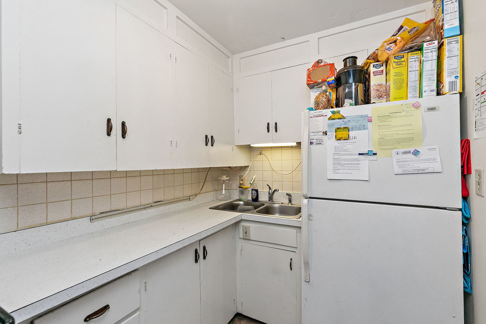 820 Lincoln Highway Rochelle, IL 61068 - Photo 18 of 27 a kitchen with stainless steel appliances a refrigerator and a sink