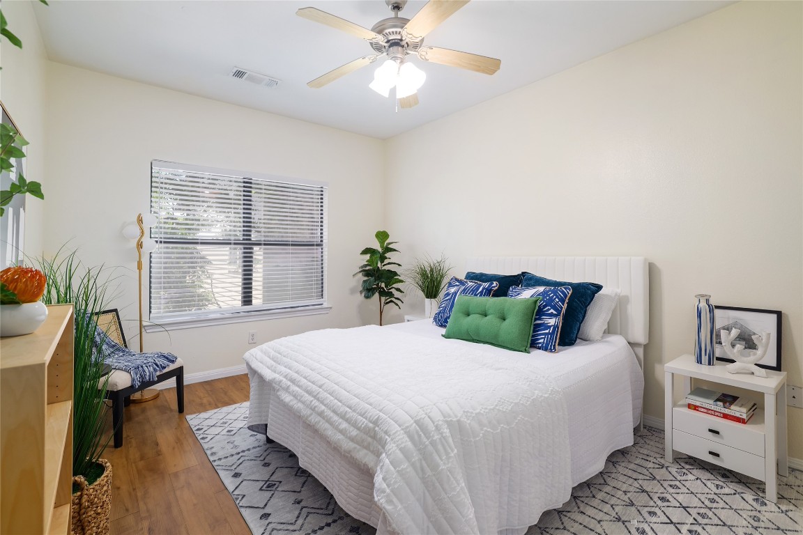 2502 Leon Street, Unit 208 Austin, TX 78705 - Photo 12 of 19 a bedroom with a bed and a large window