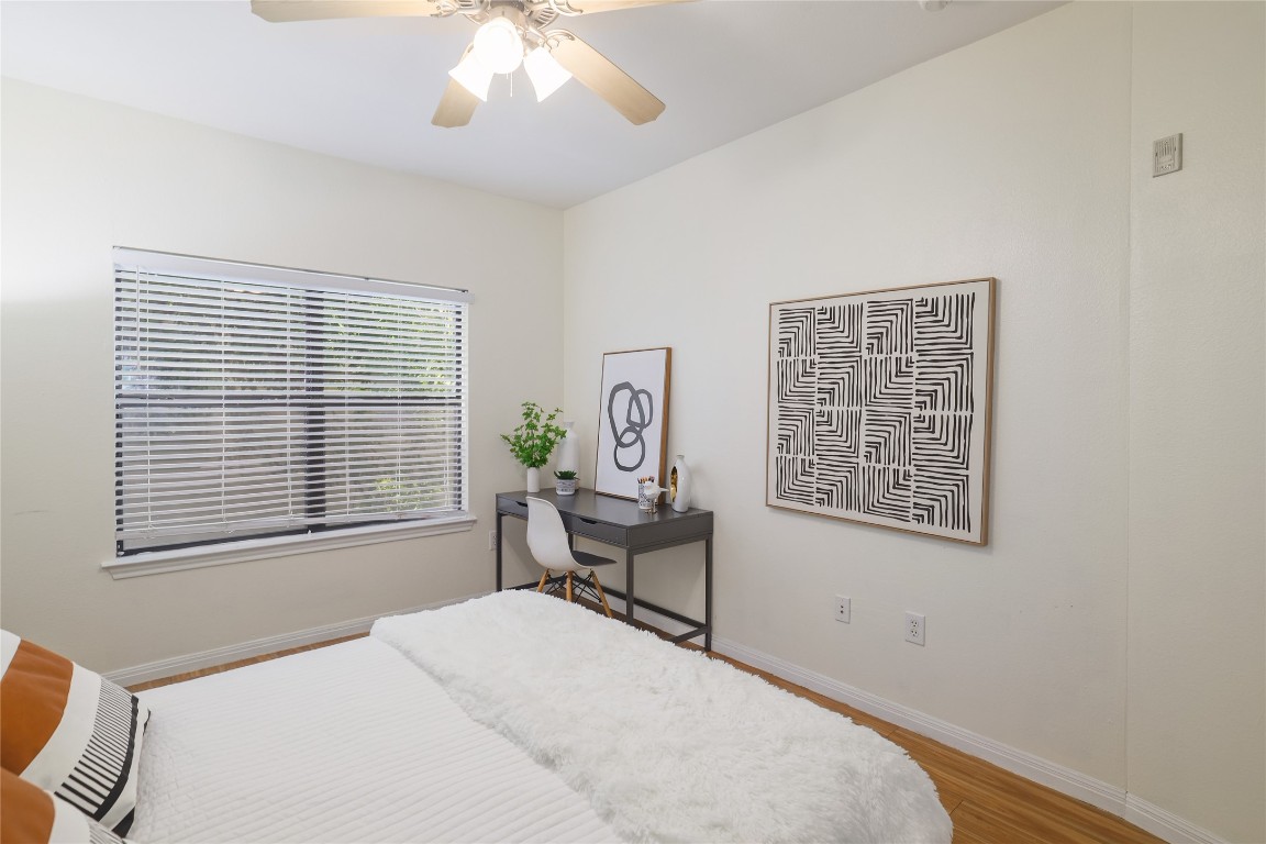 2502 Leon Street, Unit 208 Austin, TX 78705 - Photo 17 of 19 a bedroom with a bed and a window