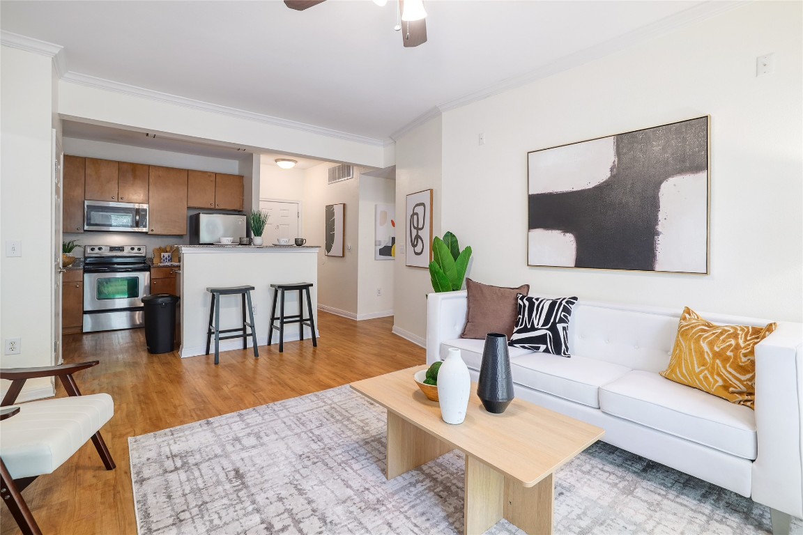2502 Leon Street, Unit 208 Austin, TX 78705 - Photo 6 of 19 a living room with furniture and wooden floor
