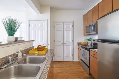 a kitchen with a refrigerator stove and microwave