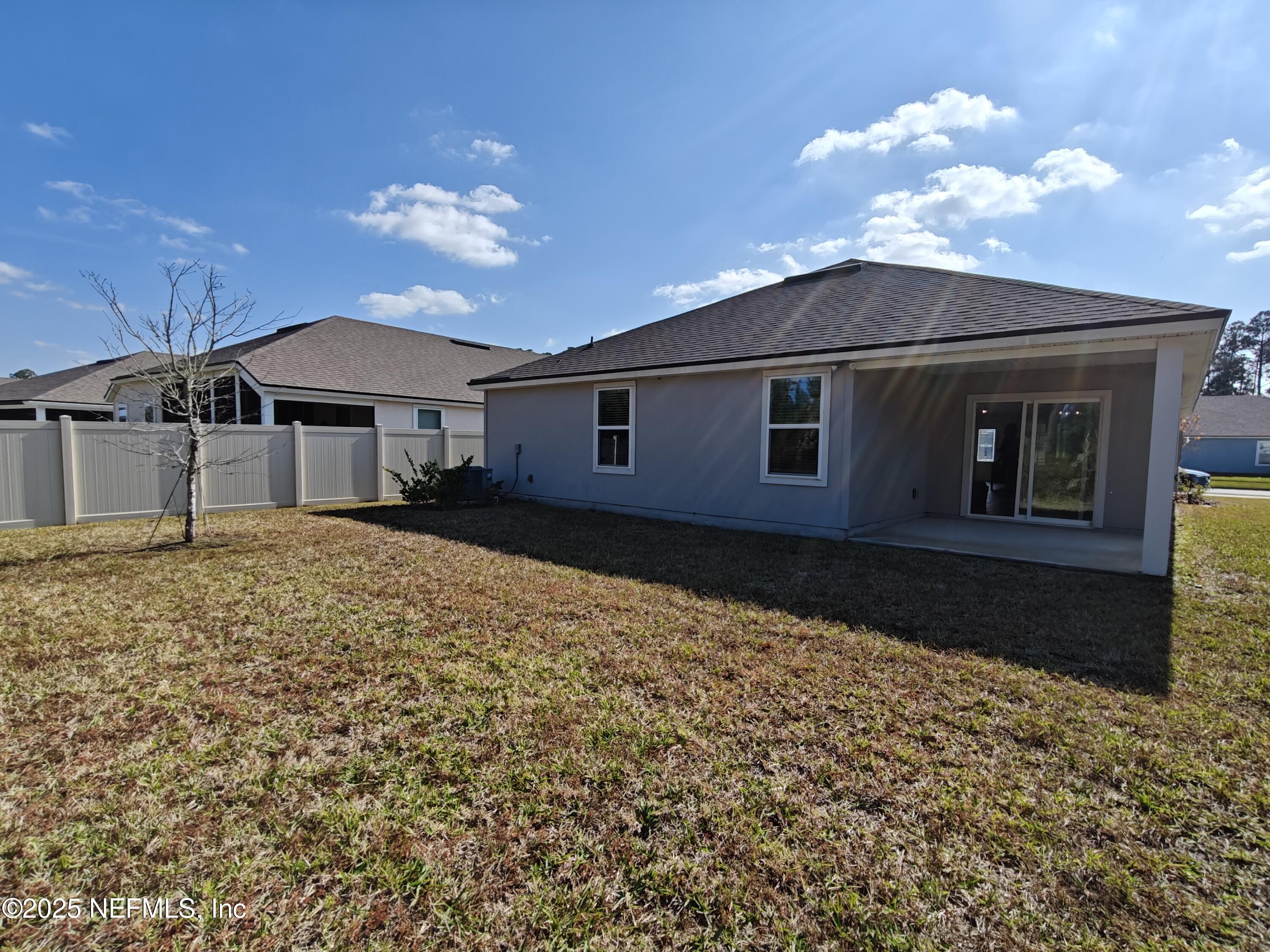 70481 Winding River Drive Yulee, FL 32097 - Photo 34 of 53 a house view with a garden space