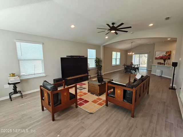 a bedroom with a bed and a television