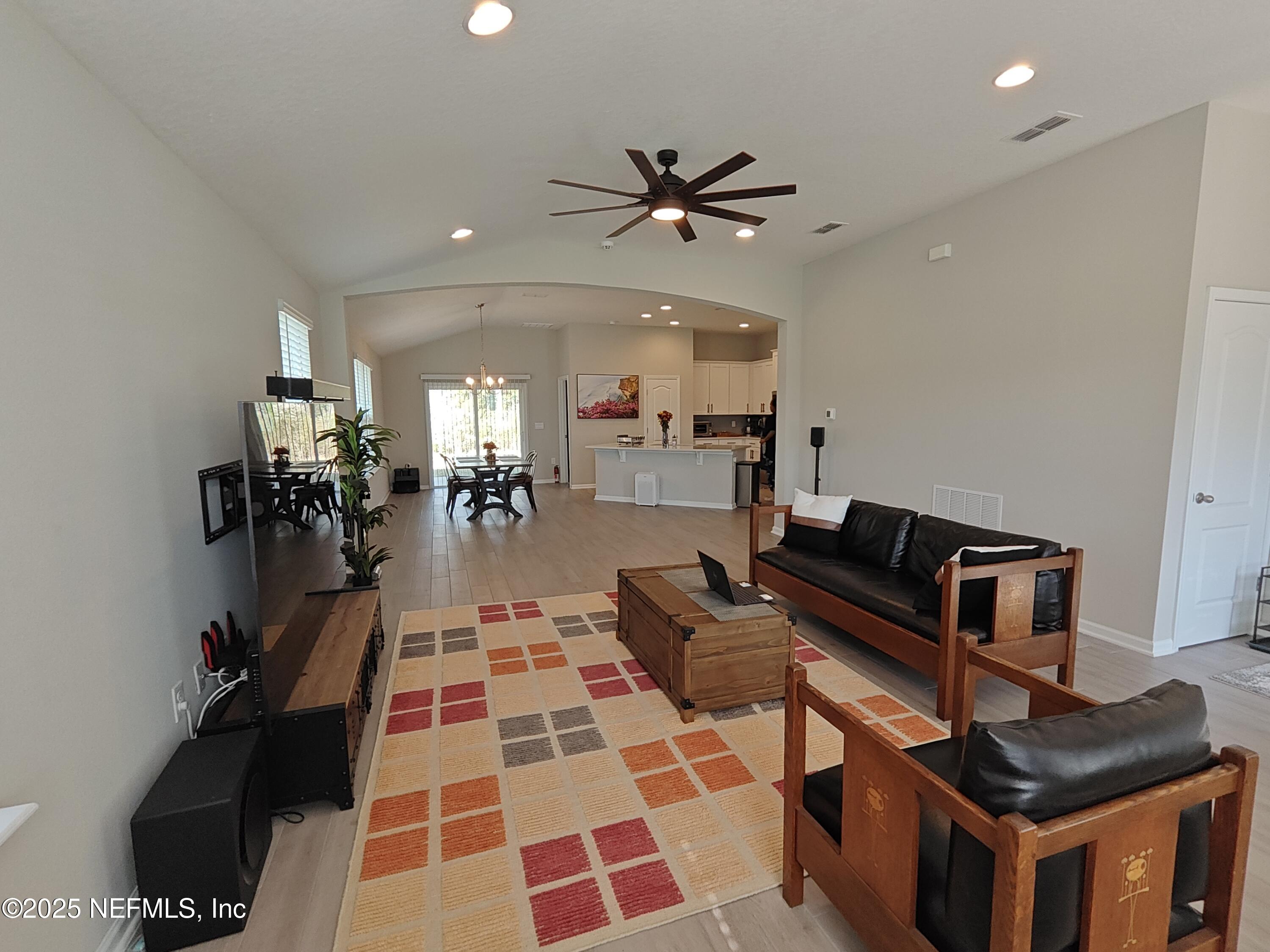 70481 Winding River Drive Yulee, FL 32097 - Photo 10 of 53 a living room with furniture and a rug