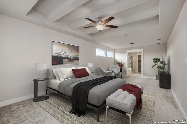 a bedroom with a bed and ceiling fan