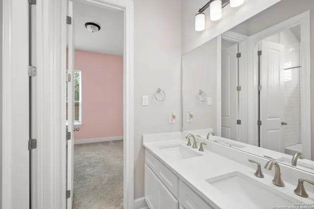 a bathroom with a sink and a mirror