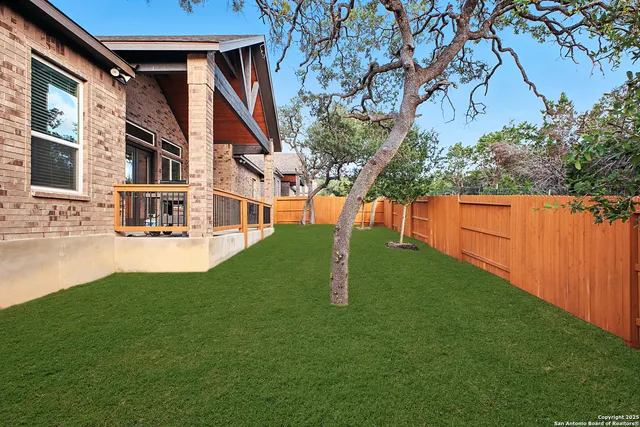 a view of backyard with swimming pool
