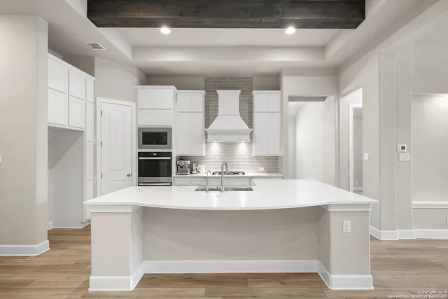 a view of kitchen with wooden floor