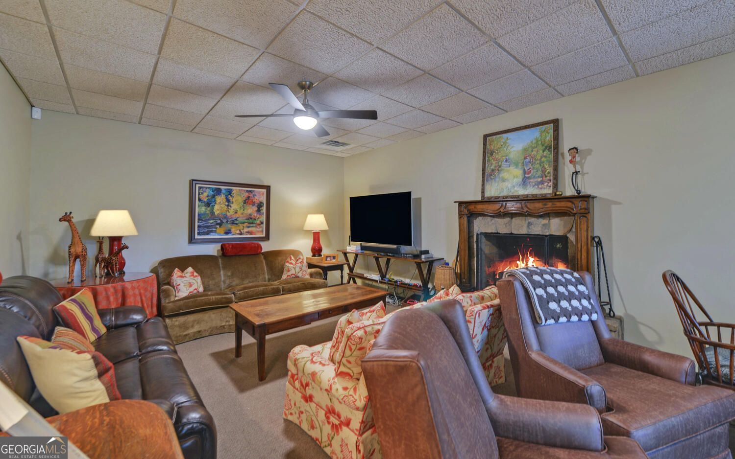 3540 Lake Rabun Road Lakemont, GA 30552 - Photo 45 of 81 a living room with furniture a flat screen tv and a fireplace