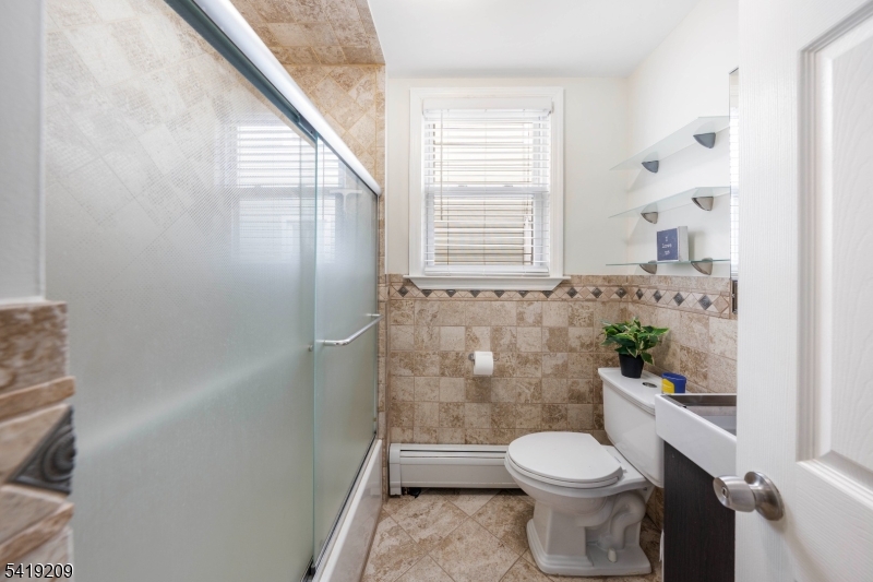 752 Eaton Street Elizabeth, NJ 07202 - Photo 12 of 27 a bathroom with a toilet and a shower