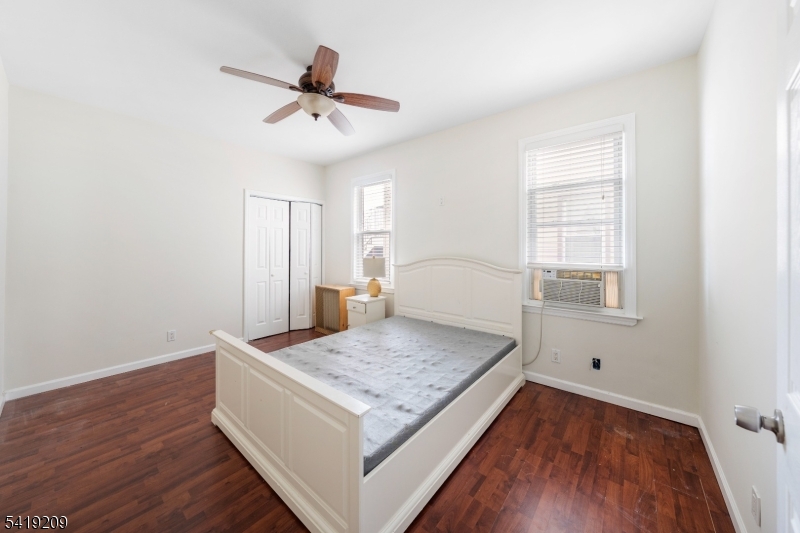 752 Eaton Street Elizabeth, NJ 07202 - Photo 14 of 27 a living room with hard wood floors and a wooden floor